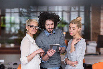 Image showing group of Business People Working With Tablet in startup office