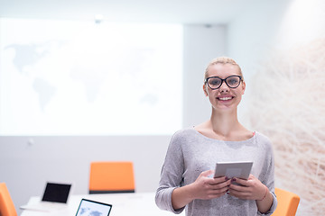 Image showing woman working on digital tablet in night office