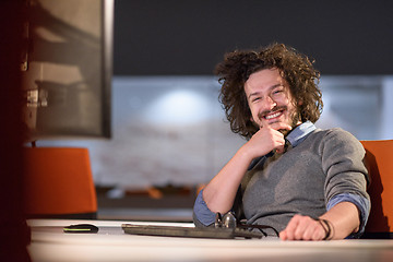 Image showing man working on computer in dark startup office