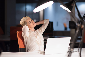 Image showing woman working on laptop in night startup office