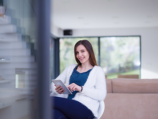 Image showing young women using tablet computer by the window