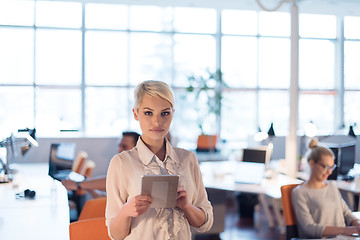 Image showing woman working on digital tablet in night office