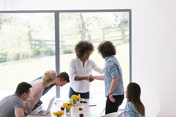 Image showing multiethnic startup Group of young business people celebrating s