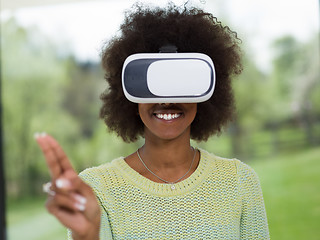 Image showing black woman using VR headset glasses of virtual reality