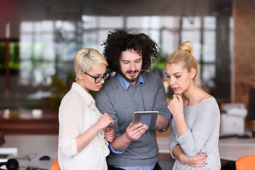 Image showing group of Business People Working With Tablet in startup office