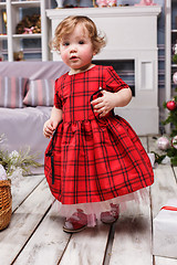 Image showing Little girl standing at studio with christmas decorations