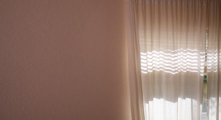 Image showing sunlight shining through curtains and blank wall