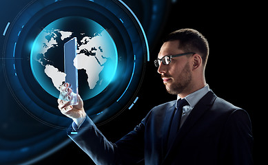 Image showing businessman with tablet pc and virtual globe