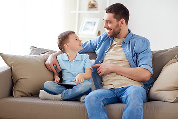 Image showing father and son with tablet pc at home