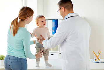 Image showing happy woman with baby and doctor at clinic