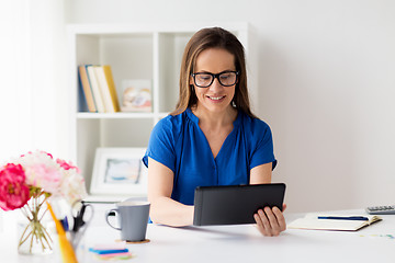 Image showing woman with tablet pc working at home or office