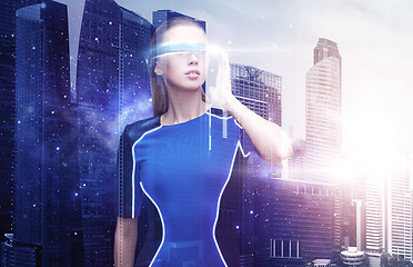 Image showing woman in virtual reality glasses over space city