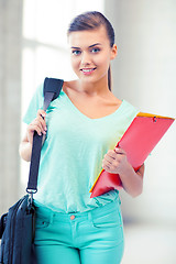 Image showing student girl with school bag and color folders