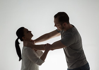 Image showing couple having fight and man choking woman