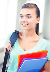 Image showing student girl with school bag and color folders