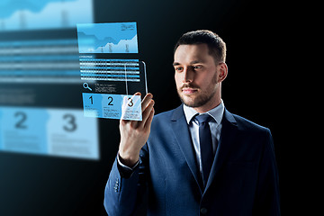 Image showing businessman with smartphone and exchange charts