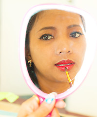 Image showing Applying Lip Gloss In Mirror Shows Beauty