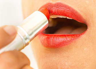 Image showing Girl Applying Lipstick Shows Beauty And Glamour