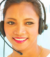 Image showing Smiling Helpdesk Operator Shows Call Center Assistance