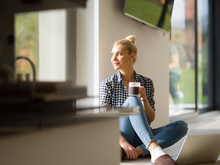 Image showing young woman drinking coffee enjoying relaxing lifestyle