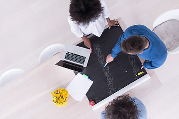 Image showing top view of Multiethnic startup business team on meeting