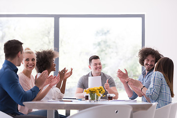 Image showing multiethnic startup Group of young business people celebrating s