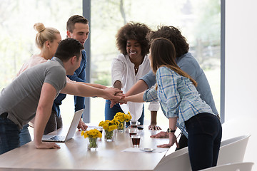 Image showing multiethnic startup Group of young business people celebrating s