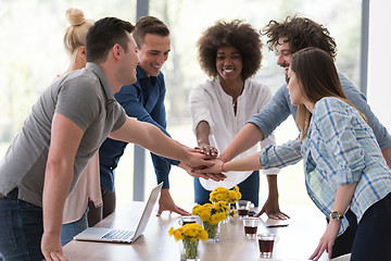 Image showing multiethnic startup Group of young business people celebrating s