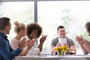 Image showing multiethnic startup Group of young business people celebrating s