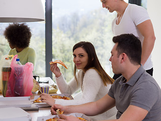 Image showing multiethnic group of happy friends lunch time