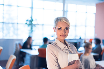 Image showing woman working on digital tablet in night office