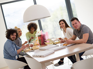 Image showing multiethnic group of happy friends lunch time