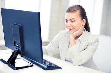 Image showing businesswoman with computer in office