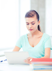 Image showing smiling student girl with tablet pc