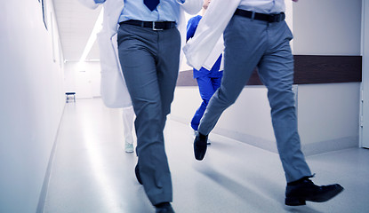 Image showing close up of medics or doctors running at hospital