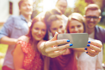 Image showing friends with smartphone taking selfie at summer