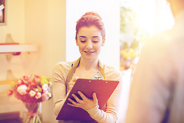 Image showing florist woman and man making order at flower shop