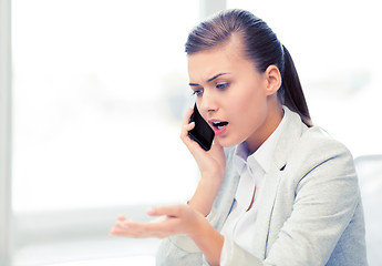 Image showing woman shouting into smartphone