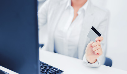 Image showing businesswoman with laptop and credit card