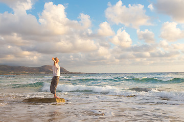 Image showing Free Happy Woman Enjoying Sunset on Sandy Beach