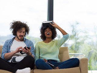 Image showing Multiethnic Couple using virtual reality headset