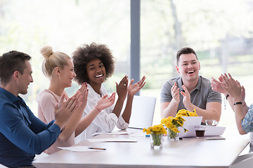 Image showing multiethnic startup Group of young business people celebrating s