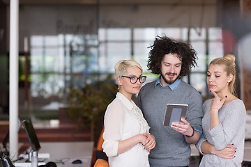 Image showing group of Business People Working With Tablet in startup office