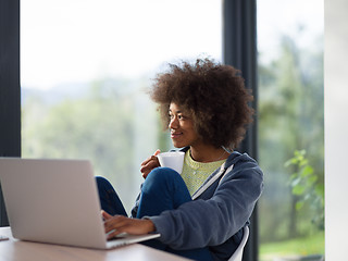 Image showing African American woman in the living room