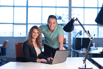 Image showing designers in the night startup office