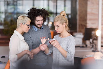 Image showing group of Business People Working With Tablet in startup office