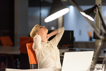 Image showing woman working on laptop in night startup office