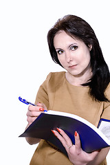 Image showing Young business woman smiling with a folder of papers in hands