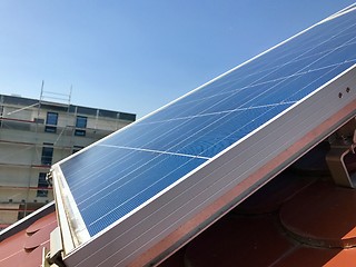 Image showing House roof with solar panels on top