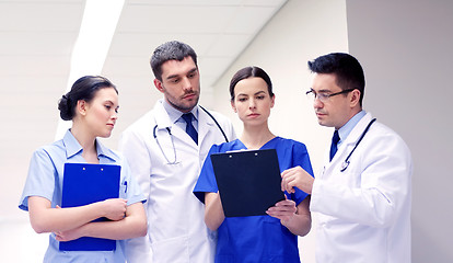 Image showing group of medics at hospital with clipboard